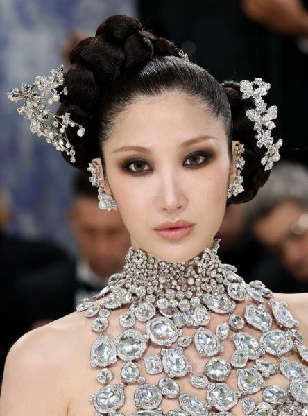 Ejae wearing a crystal dress and hair accessories at the Met Gala
