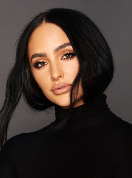 A headshot of makeup artist Ash K Holm.